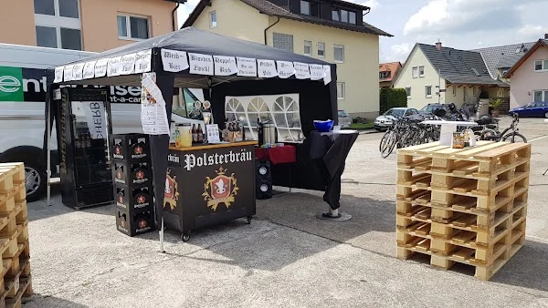Polsterbräu sales stand with pavilion and pallets